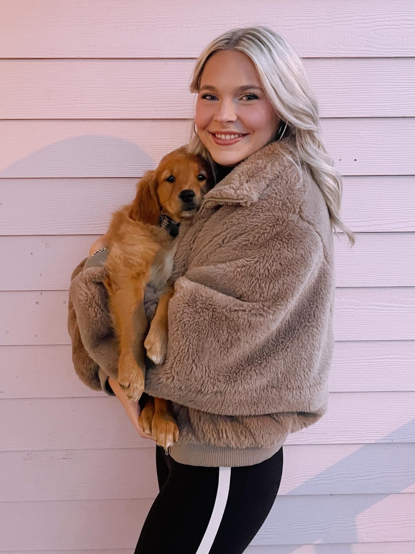 girl holding puppy
